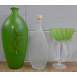 Glassware: a green leaf vase, pedestal vase and Bottega bottle