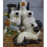 A pair of Beswick Staffordshire Spaniels, a Royal Doulton Siamese cat, a Markay Art pottery duck, an