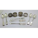 Four silver spoons, three silver forks and four silver napkin rings, 213g