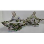 A pair of 19th Century Sitzendorf porcelain figural sweetmeat dishes, 33cm wide