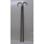 A silver handled walking stick and a silver plated handle and ebonised walking stick