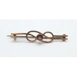 A 9ct gold and pink stone brooch, 1.4g with metal pin