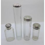 Four silver topped glass bottles, one top a/f