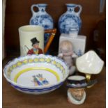 A pair of Delft blue and white ewers, a Delft flask, a Crown Devon vase and musical jug, Royal