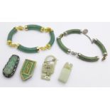 Two jade bracelets, one requires repair, a silver and jade clip marked made in China, one other
