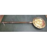 A brass and copper bed warming pan **PLEASE NOTE THIS LOT IS NOT ELIGIBLE FOR POSTING AND PACKING**