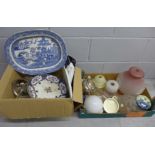 Two boxes of china and glass, willow pattern serving plate, glass light shades, etc.**PLEASE NOTE