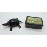 A carved tortoiseshell model of a tortoise and a 19th Century gun metal vesta with horse racing