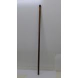 A silver topped walking cane