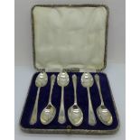 A cased set of six silver golf spoons, 82g