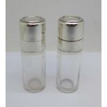 A pair of French silver topped glass scent bottles with control marks, one with stopper