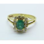 An 18ct gold, emerald and white stone ring, 3.8g, N