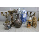 A pair of metal candlesticks, a Calvados jug, a studio pottery figure, a trophy, a figural candle
