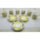 Six Crescent china coffee cans and saucers with silver cup holders by Walker & Hall, three cups a/f