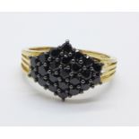 A silver gilt black spinel ring, Q