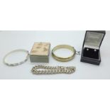 A silver bracelet, each link marked, two silver bangles, 72g, and four pairs of earrings