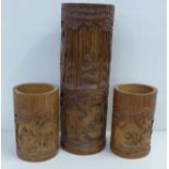 A tall carved bamboo brush pot, 33cm and a small pair of carved bamboo brush pots, 15cm