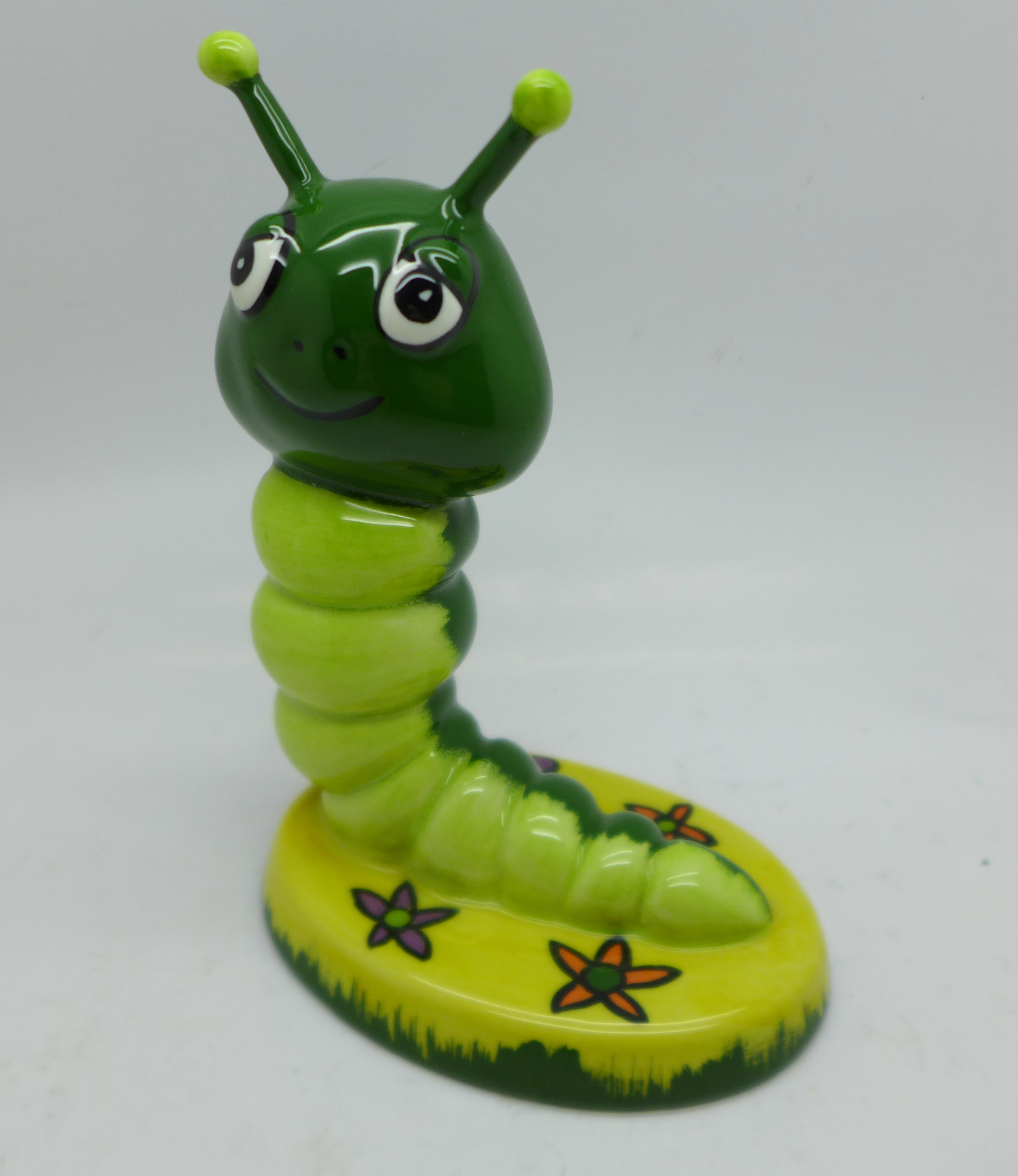 Lorna Bailey; an early caterpillar figurine 'Creepy Crawly' with the 'Old Ellgreave Pottery' stamp