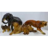 A Melba Ware model tiger, lion and cub, a model elephant and elephant calf, one elephant tusk