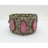 A bangle set with pink stones, a/f