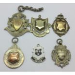 Five silver fob medals, three with gold applied decoration and one other fob medal marked Durban