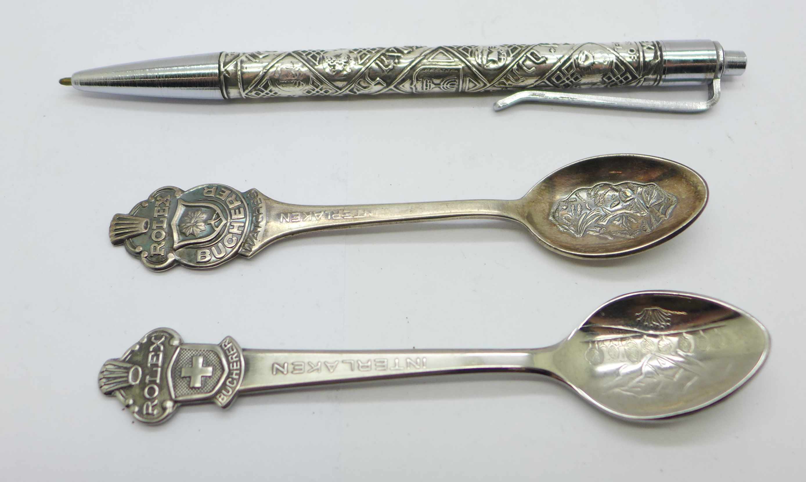 A sterling silver ballpoint pen, marked 'made in Israel' and 'Rolex', and two Rolex spoons
