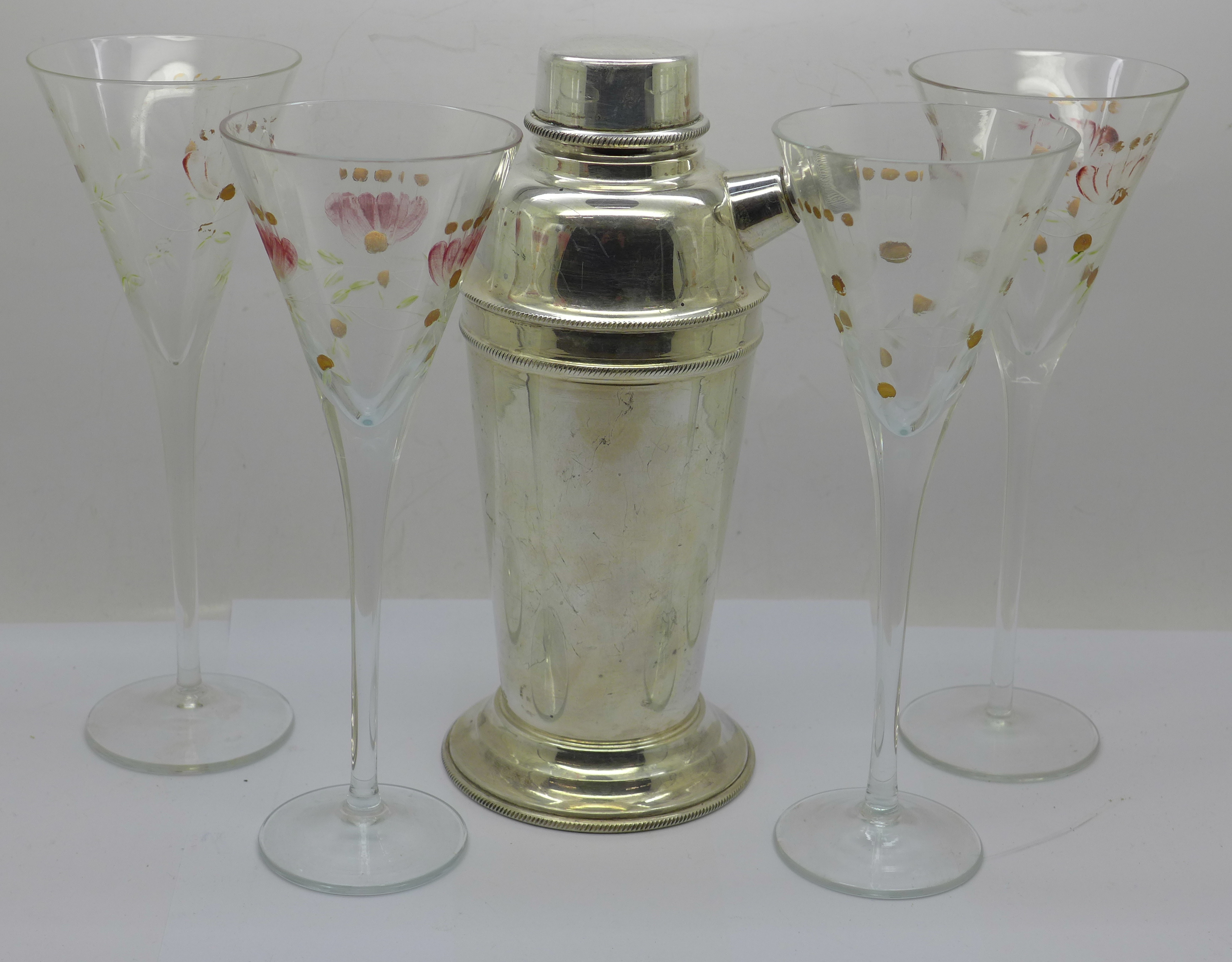 A Viners plated cocktail shaker and four tall cocktail glasses