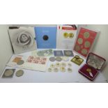 A collection of coins including commemorative and one bank note