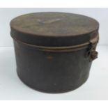 A metal hat box and three advertising tins