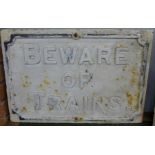 A 'Beware of Trains' cast iron sign, 57cm x 39cm
