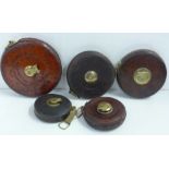 A collection of Chesterman tape measures, five in total
