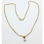 A 9ct gold chain with a yellow metal set diamond pendant, 7.1g