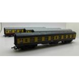 Four 00 gauge Mainline coaches in maroon and cream