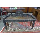 A Victorian Jacobean Revival carved oak window seat