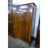 A walnut fitted wardrobe