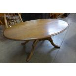 An Ercol Golden Dawn elm oval coffee table