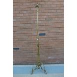 An Arts and Crafts brass telescopic floor standing down lighter, manner of W.A.S. Benson