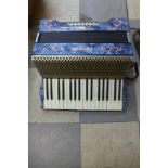 A Hohner Carmen II accordian, cased