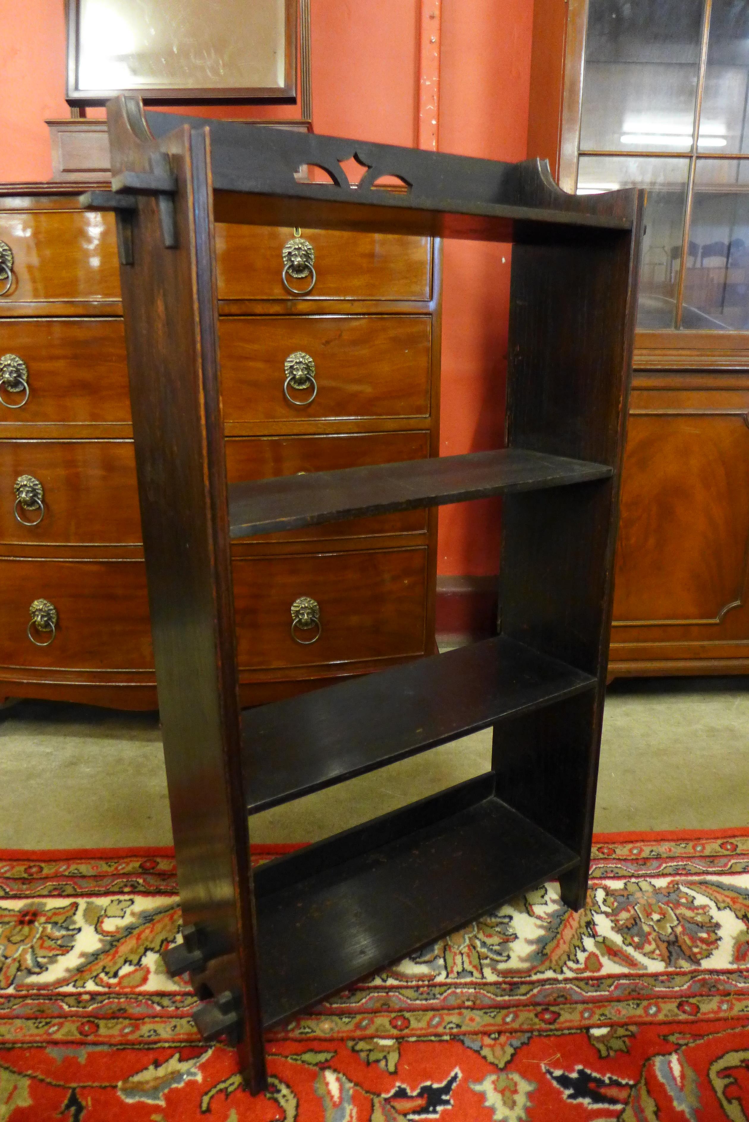 An Arts and Crafts oak open bookcase