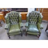 A pair of mahogany and green buttoned leather wingback armchair
