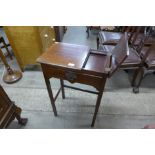 A small Edward VII mahogany writing table