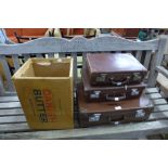 Three small vintage suitcases and an advertising box