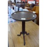 A mahogany tripod wine table