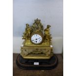 A 19th Century French gilt mantel and alabaster mantel clock
