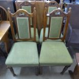 A set of four Edward VII walnut and upholstered dining chairs