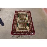 An eastern cream ground rug, 137 x 88cms