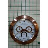 A Rolex style dealer's display circular wall clock