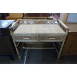 A bamboo and rattan two drawer desk