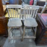 A pair of Victorian elm and beech kitchen stools