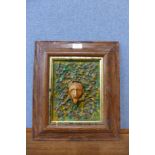 A Surrealist acrylic and terracotta high releif wall hanging plaque